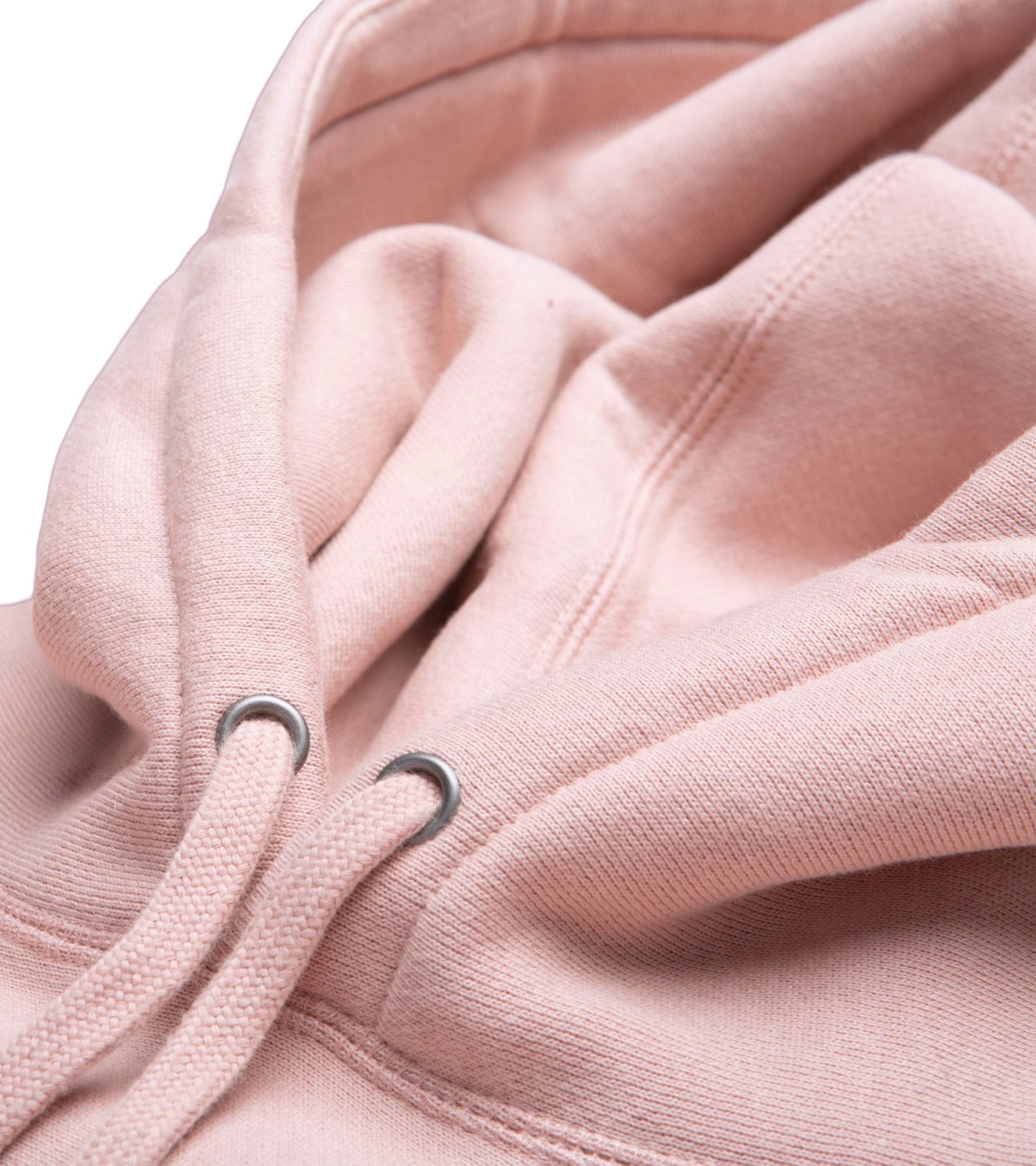 Close-up detail of double fleece lined hood, antique silver eyelets and cotton shoestring drawcord on Grow Empathy heavyweight cross-grain hoodie in dusty pink