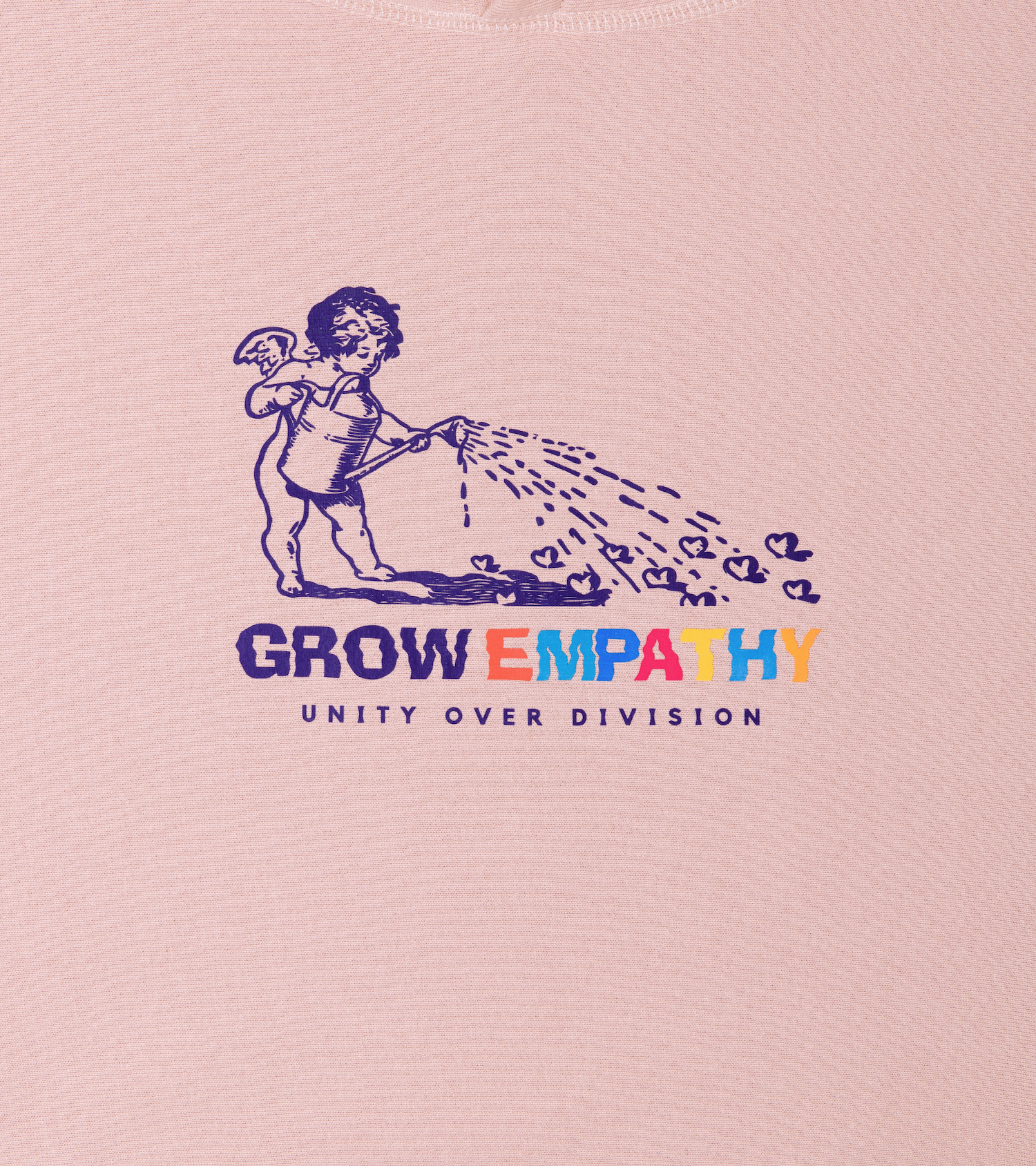 Close-up of Grow Empathy Unity Over Division front graphic on heavyweight cross-grain hoodie in dusty pink